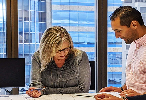 construction-team-site-plans-04-050223 Careers in construction showing staff looking at site plans